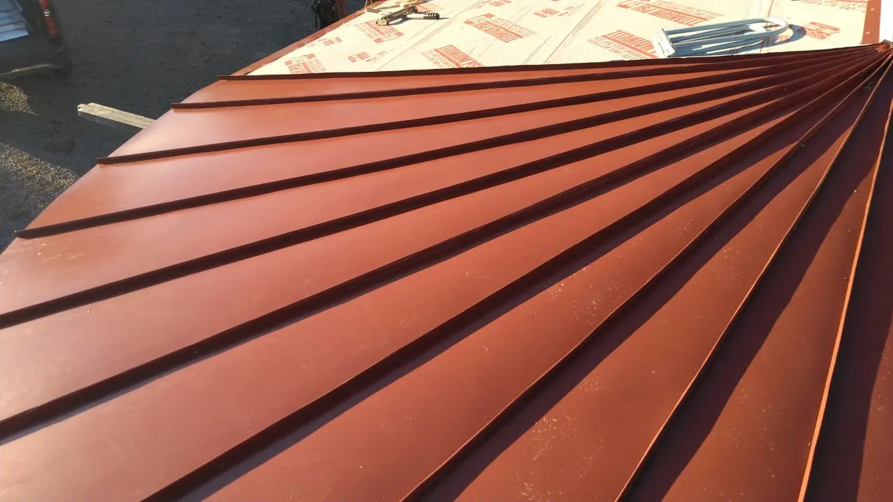 Red tapered panels fanning out on a curved roof.