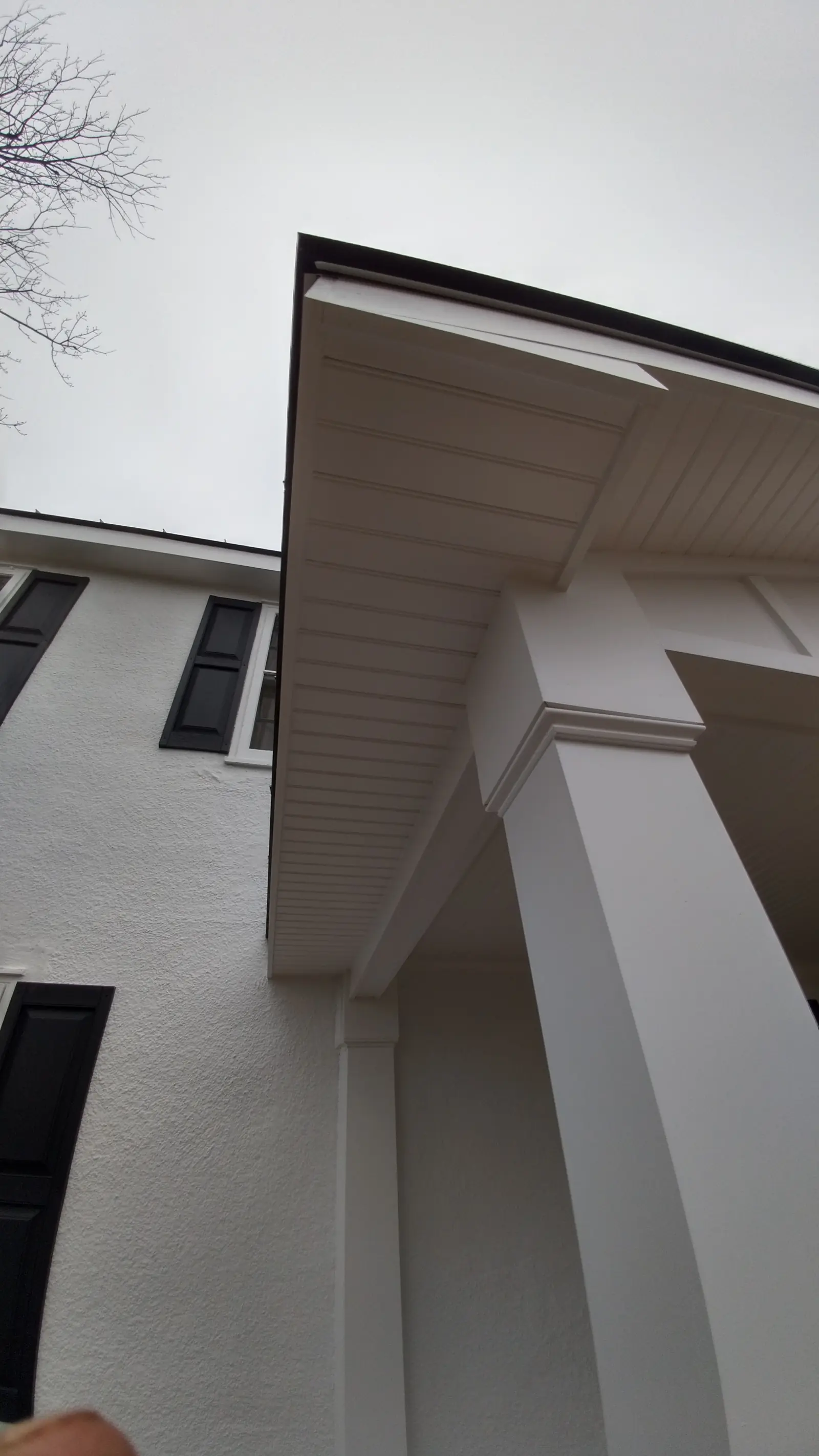 White porch column and soffit corner with fresh trim.